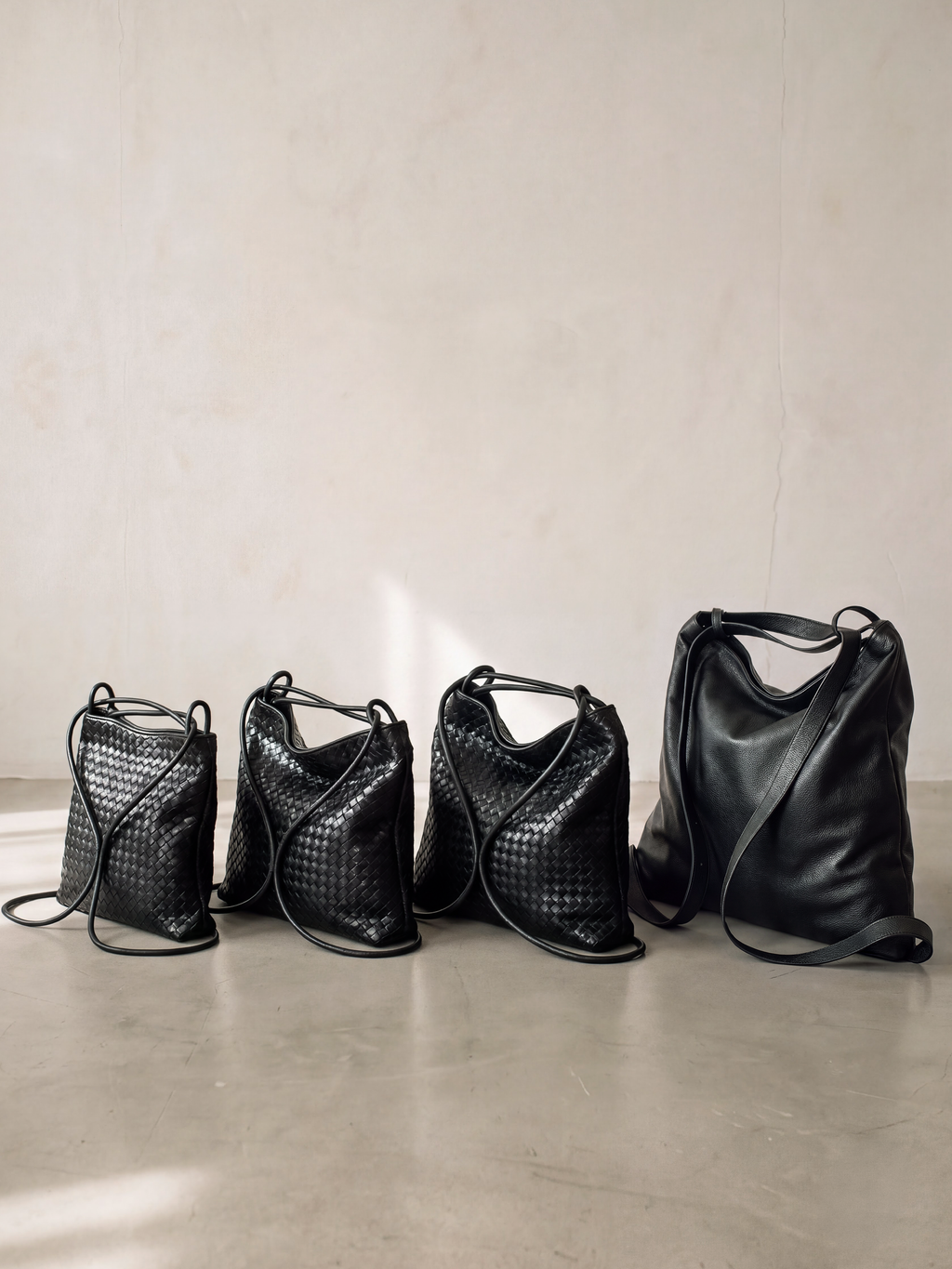 Versa Large Matte Black Woven Convertible Leather Tote