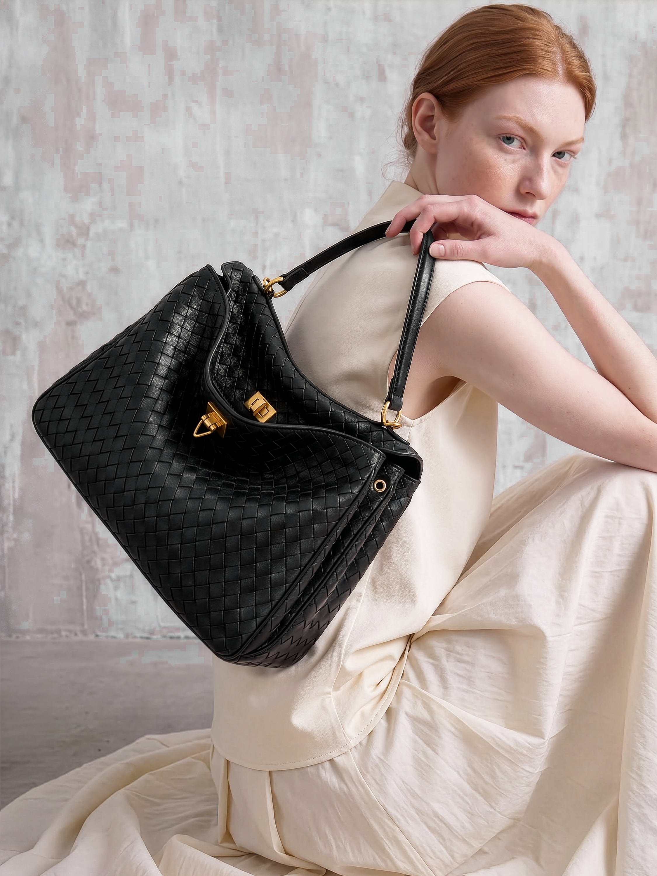 Soluta Black Woven Leather Top Handle Bag