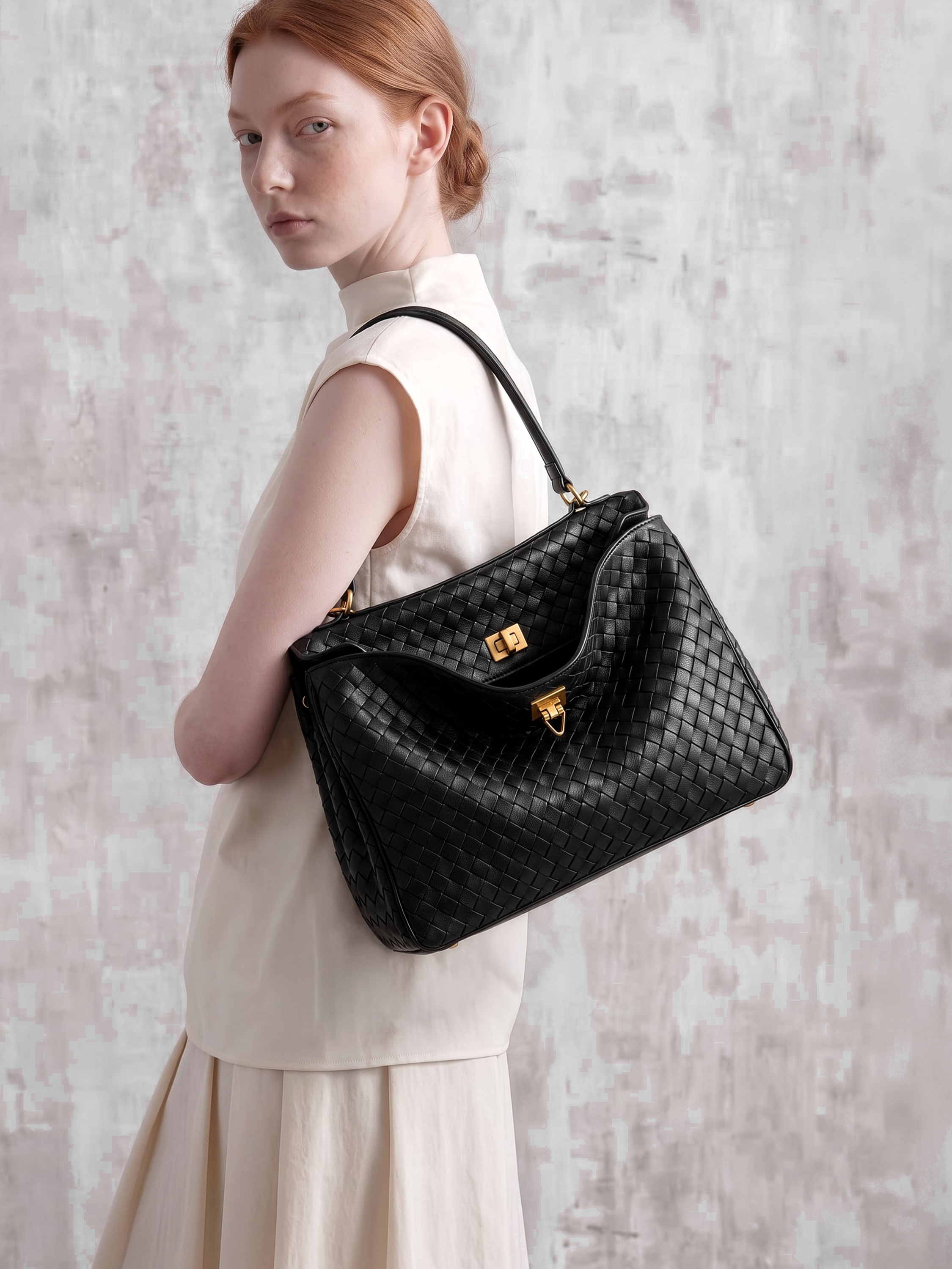 Soluta Black Woven Leather Top Handle Bag