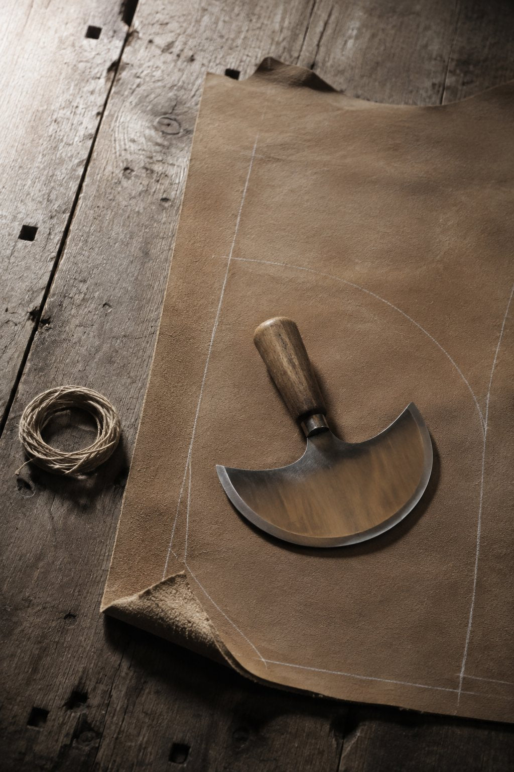 A pattern-marked hide on the cutting bench